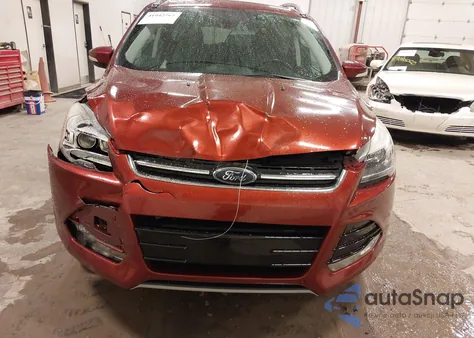 2016 Ford Escape Titanium z USA, uszkodzony, nr VIN 1FMCU9JX0GUC65615